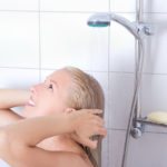 24369403 – young attractive woman having a shower in bathroom