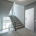 Modern,Interior,Of,New,Entrance,In,Residential,Building.,Wooden,Door